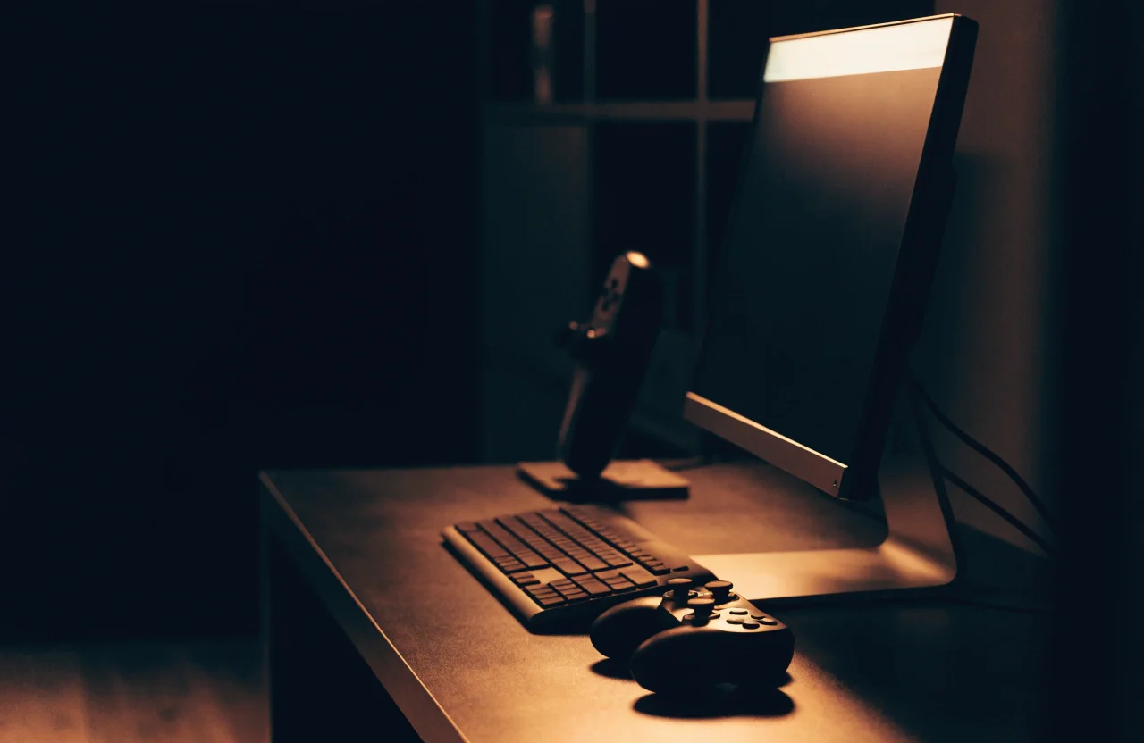 Console and handheld gaming hardware on a desk